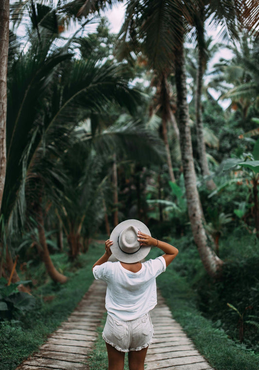 Woman in the jungle exploring with confidence